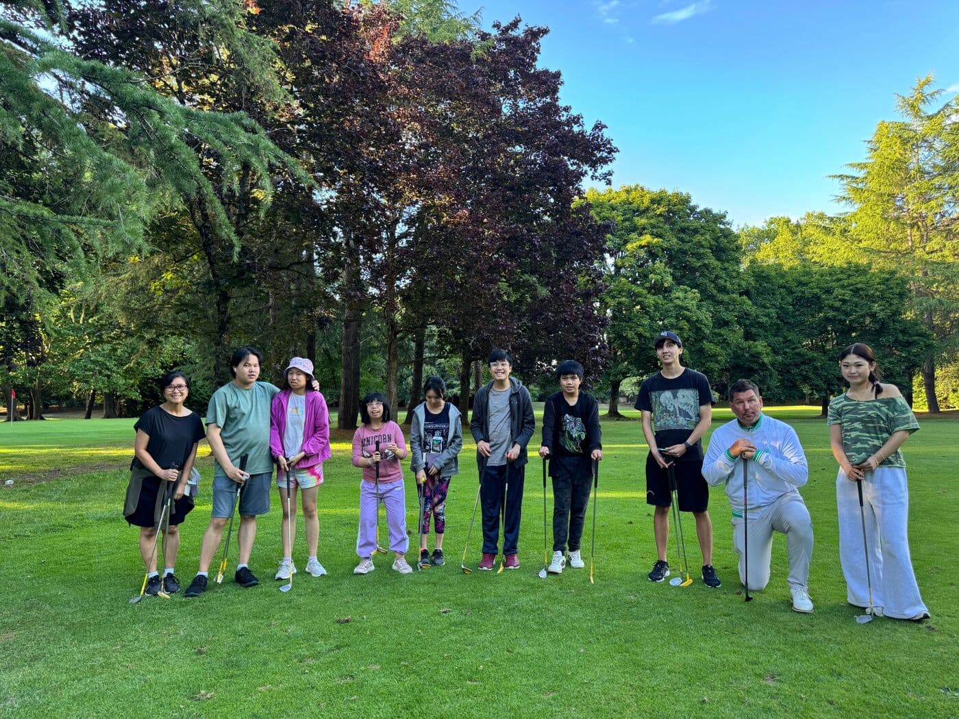 Participants and coaches at golf lessons