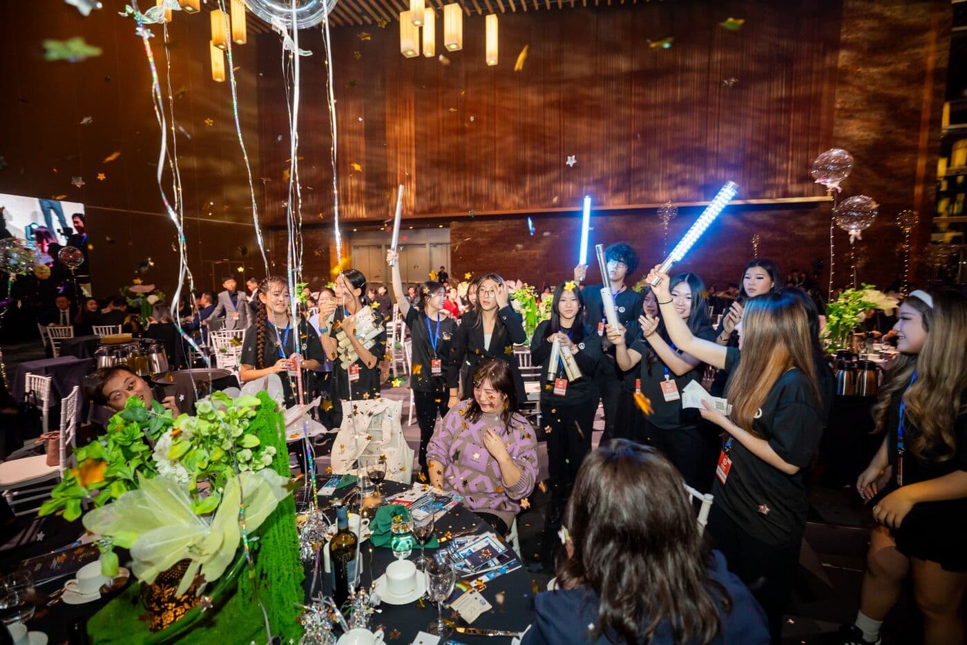 SDC youth volunteers celebrating with confetti at the gala