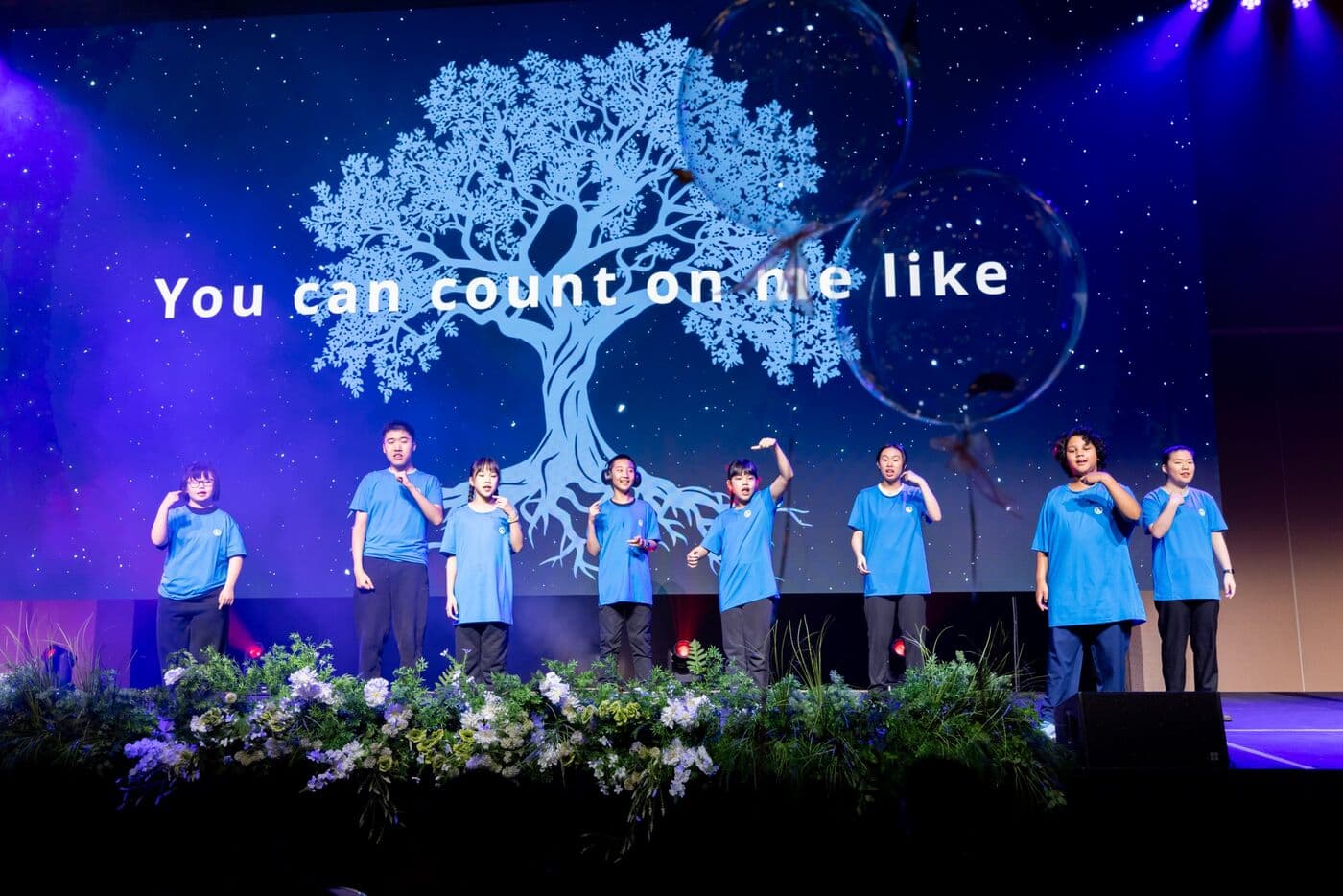 SDC participants singing on stage