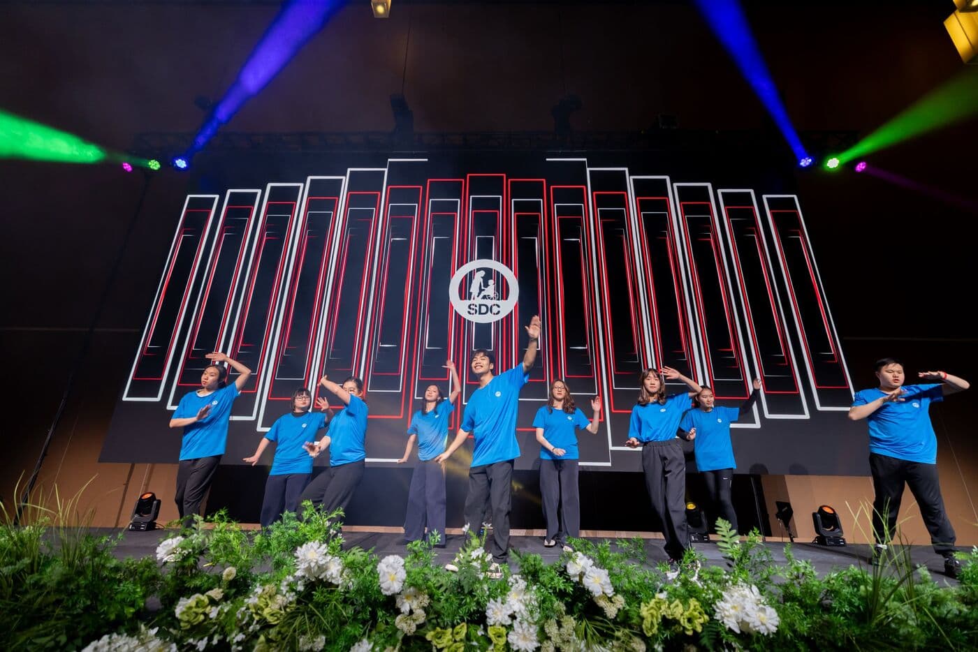 SDC participants dancing on stage